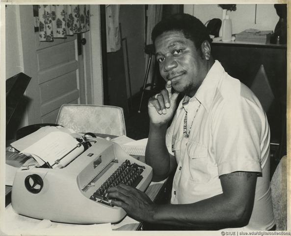 Eugene Redmond at a typewriter