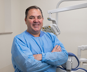 Alan Wickenhauser portrait in dental scrubs