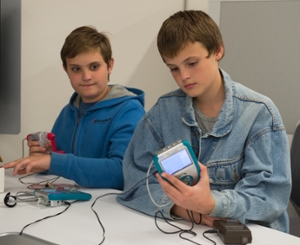 Brothers Joseph Stewart (L) and Joshua Stewart (R), seventh grade students at Bunker Hill Middle School, use Vernier Lab Quests and probes. 