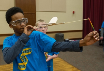 Pontiac Junior High students Cameron Jackson (front) and Aiden Toohey participate in the Elastic Launch Glider event.