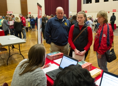 Photo: Brittany Vordtriede, of O’Fallon, Mo., and her parents speak to an SIUE representative during the Transfer Visit Day Student Services Fair.