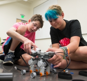 Montgomery Hubler (L) and Sydney Krueger (R) work on a robotics project.