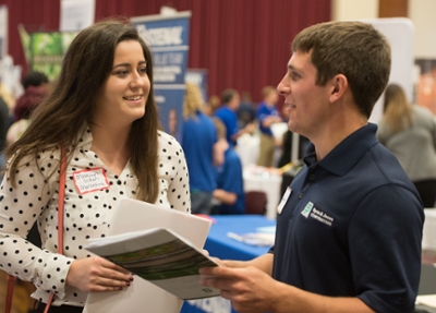 SIUE’s Madelyn Diden, a junior majoring in management and marketing, visits with Jesse Humphrey of Byrne & Jones Construction during the October Career Fairs.