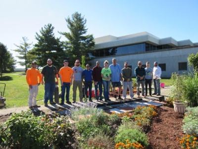 A group of volunteers, including School of Pharmacy Dean Gireesh Gupchup, members of SIUE’s Constructors Club, and members of the Rotary Club, installed engraved pavers at the School’s Medicinal Garden. 