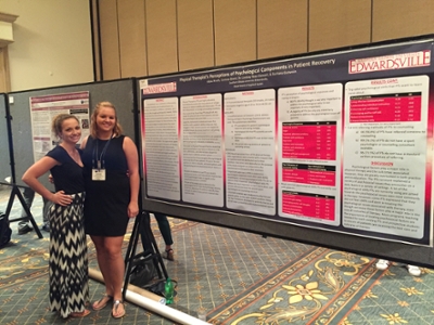 (L-R) SIUE master’s candidates Alexa Knuth and Corinne Brent present their research poster at the 2016 Association for Applied Sport Psychology conference in Phoenix, Arizona.