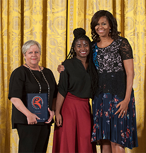 SIUE alumnus Priscilla Block, executive director of St. Louis ArtWorks, and teen apprentice AnnaLise Cason accepted the 2016 National Arts and Humanities Youth Program Award from First Lady Michelle Obama during a ceremony at the White House. 