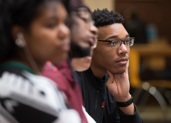 Belleville native Nick Givens, a sophomore studying psychology, listens intently to the featured presentations during the Black Heritage Month kickoff celebration at SIUE.