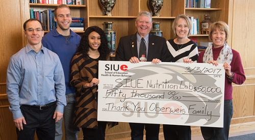 (L-R) Erik Kirk, PhD, chair of the SIUE Department of Applied Health, students Matthew Schreder and Amanda Hyde, both pursuing a bachelor’s in nutrition, Senator Jim Oberweis, Jennifer Zuercher, PhD, assistant professor of nutrition, and Cindy Inman, instructor of nutrition.