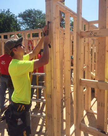 Jordan Grant, vice president of the SIUE Constructors Club, puts his skills to use during the East Side Heart and Home Family Center’s Blitz Build. 