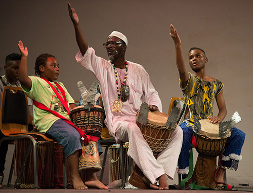 Demetrious Sylla (left) and Gysai Sylla (right) participate in a West African drum performance.