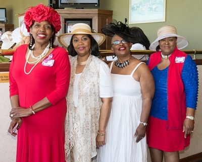 Brenné Issa, Meridian Society member and SIUE alumnus, won the award for best member hat. She stands with fellow SIUE alumni Deborah Brooks, Mary Rogers and Jewel Reid.
