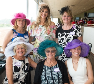 This group of women was all smiles donning vibrant ensembles during the Meridian Derby.