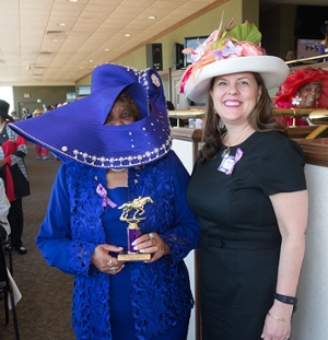 Vice Chancellor for University Advancement and CEO of the SIUE Foundation Rachel Stack (right) stands with SIUE alumnus Jackie Keller Smith (left) who won the biggest hat award for her show-stopping purple hat.