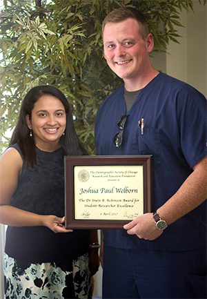 (L-R) SIU SDM’s Dr. Anita Joy stands with fourth-year dental student Joshua Welborn, who earned The Odontographic Society of Chicago Dr. Irwin B. Robinson Student-Researcher Award for 2017.
