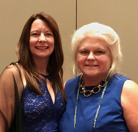 (L-R) Valerie Griffin, DNP, assistant clinical professor and coordinator of the family nurse practitioner program, stands with her sponsor Mary M. Aruda, PhD, during the induction ceremony.