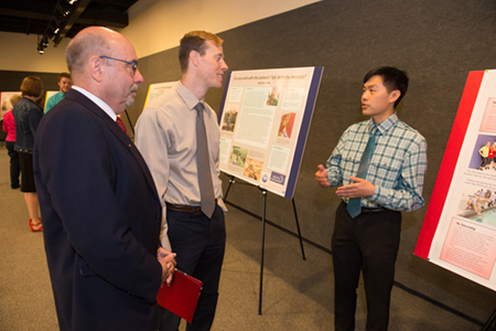During the Noyce Summer Scholars Showcase Justin Shiau described his summer experience to Paul Rose, PhD, interim dean of the School of Education, Health and Human Behavior (middle), and Greg Budzban, PhD, dean of the College of Arts and Sciences.