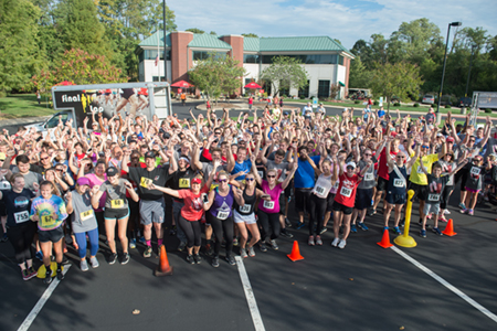 Participants in the SIUE Cougars Unleashed Homecoming Run celebrate the successful event.