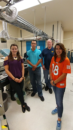 Amelia Teare (far right), a Noyce scholar, stands with colleagues in the Air Force Research Lab on Edwards Air Force Base in California.
