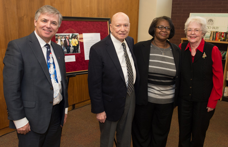 During the reception, SIUE presented Dr. Earl Lazerson with a commemorative photo and proclamation. Standing (L-R) are Chancellor Randy Pembrook, Dr. Earl Lazerson, LIS Interim Dean Lydia Jackson and Mrs. Ann Lazerson.