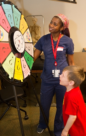 JaTerra Castine-Ross, a third-year SIU School of Dental Medicine student, leads an educational station during National Children's Dental Health Month.