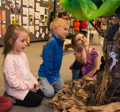 (L-R) Emmie, AJ and Willow admire the Busy Tree sculpture they helped make.