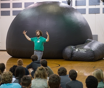 SIUE STEM Resource Center Manager Colin Wilson told Edwardsville students about the constellations they would see while inside the inflatable planetarium.