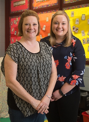SIUE elementary education graduate Katie Shannon (right) and her cooperating teacher Ina Bowling smile in Bowling's classroom at Webster Elementary School in Collinsville.