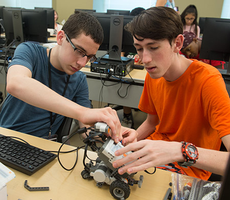 Seth Smidowicz, of Edwardsville, and Aden Harriman, of Peoria, work on a robotics project during SIUE Engineering Camp.