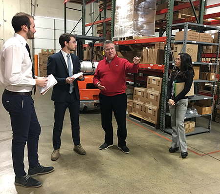 (L-R) SIUE alumni Gabriele Fancelli and Pietro Beimer, of Italy, stand on site with International Trade Center at SIUE client Craig Eversmann, president and CEO of Marsh Shipping Supply Co, LLC, and ITC at SIUE Director Silvia Torres-Bowman.