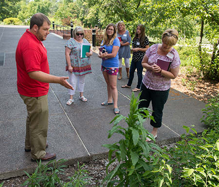 Matt Johnson, instructional design and curriculum specialist with the SIUE STEM Center, leads a group of teachers on a nature tour during the “STEM Notebooks: Understanding History Through a STEM Lens” workshop. 