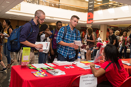 Capri Wroten, of Chicago, reacts happily to her newly created caricature during the SIUE Resource Fair. Nathan Cauley (left), of Bunker Hill, and Logan Siekmann, of Troy, visit with a representative from the Kimmel Student Involvement Center during the SIUE Resource Fair.
