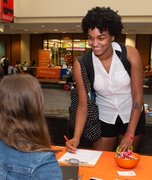 SIUE sophomore Mahdi Gourdine signs up to learn more about volunteer opportunities with the National Multiple Sclerosis Society.