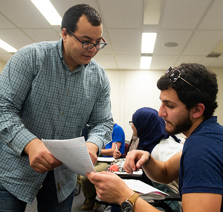 SIUE Visiting Fulbright Scholar Wajdi Balloumi, of Tunisia, works with an SIUE student.
