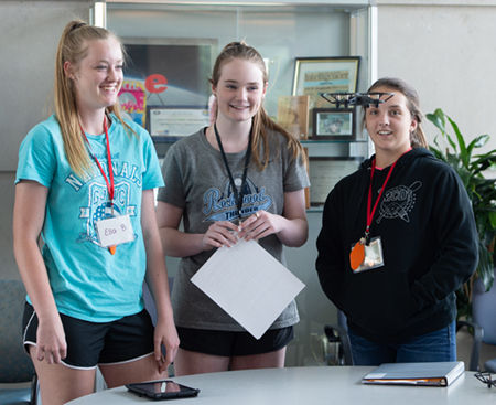 SIUE School of Engineering Summer Camp participants (L-R) Ella Bockhorn, of Waterlook, Hailey Montgomery, of Waterloo, and Avery Rogers, of Effingham, engage in a drone activity. 
