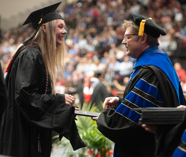 Graduate Shelbi Paul accepts her diploma