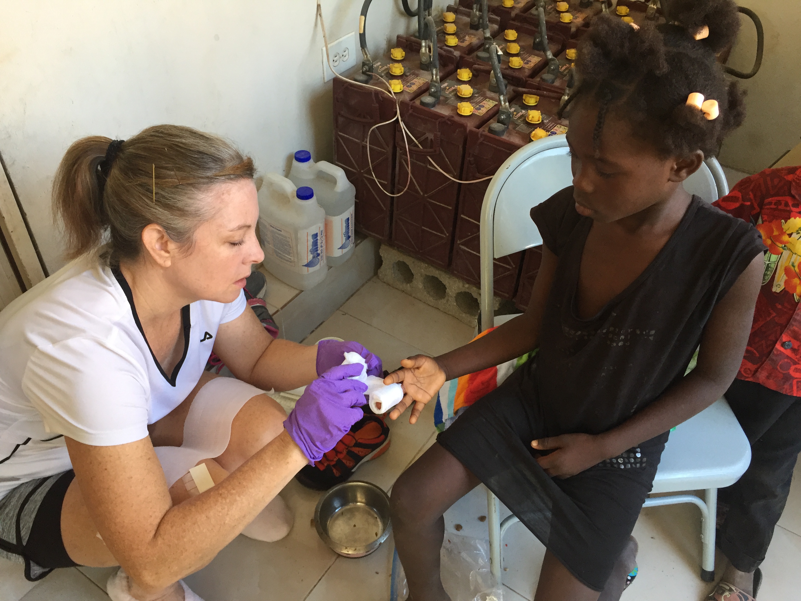 Dr. Griffin cares for a patient in Haiti