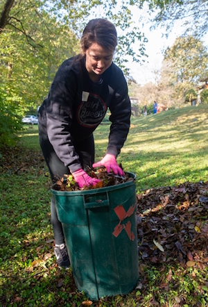 Pharmacy student Lesley Swick loads a can of leaves 