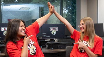 SIUE students high five.