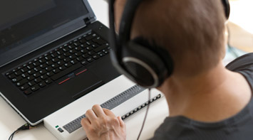 Student working at a computer.