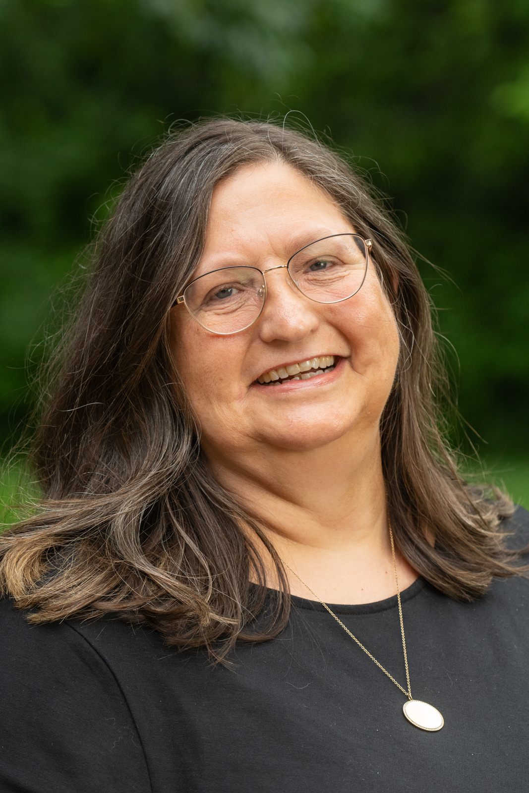 A portrait photo of Lucinda Antonacci-Fulton