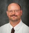 A portrait photo of Dr. Bill Retzlaff