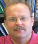A portrait photo of Dr. Kurt Schulz