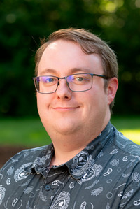 A portrait photo of Dr. Maximilian Lyon