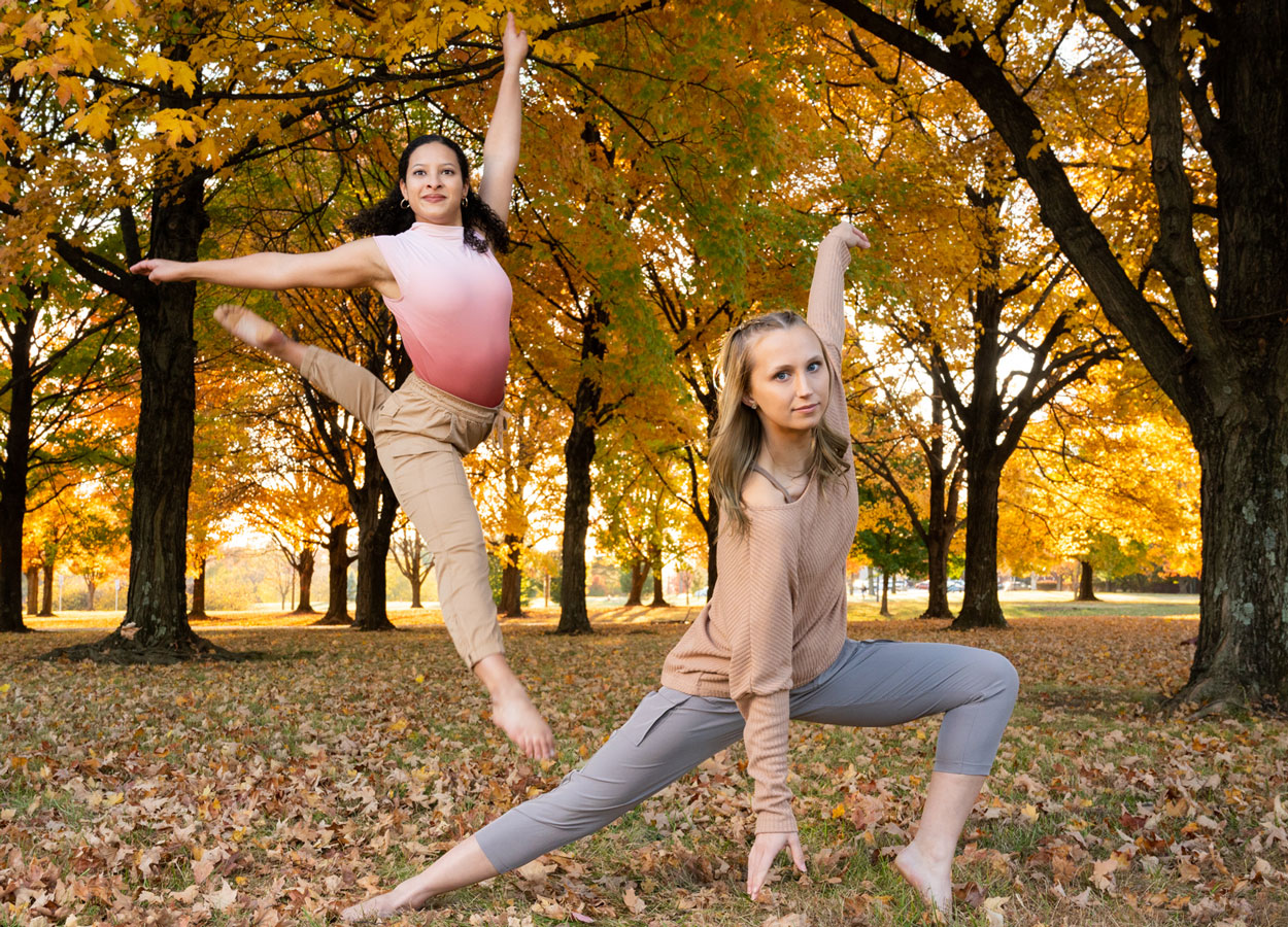 Two students dancing in an autumn background
