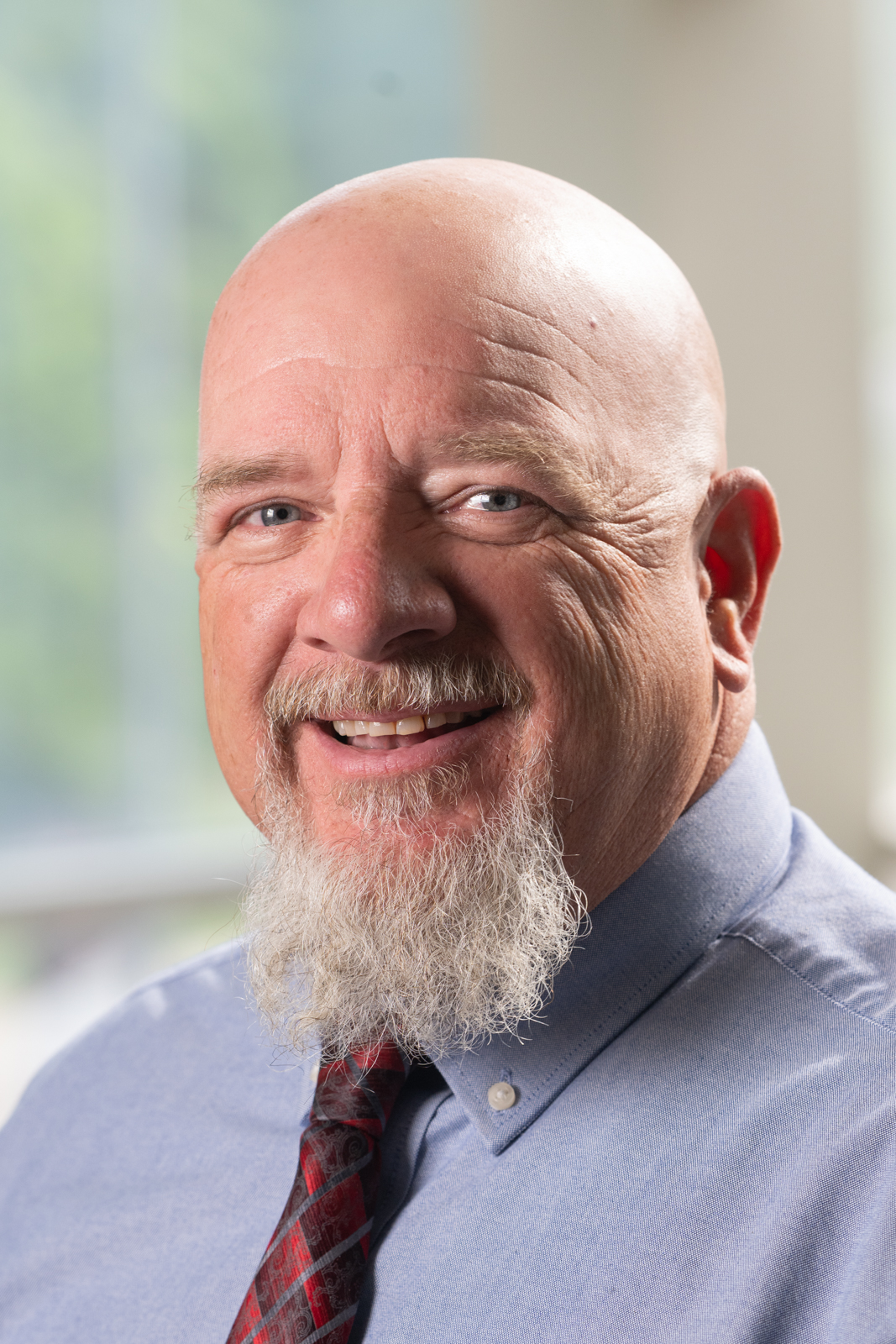A portrait photo of Doug James (Staff Senate Past President)