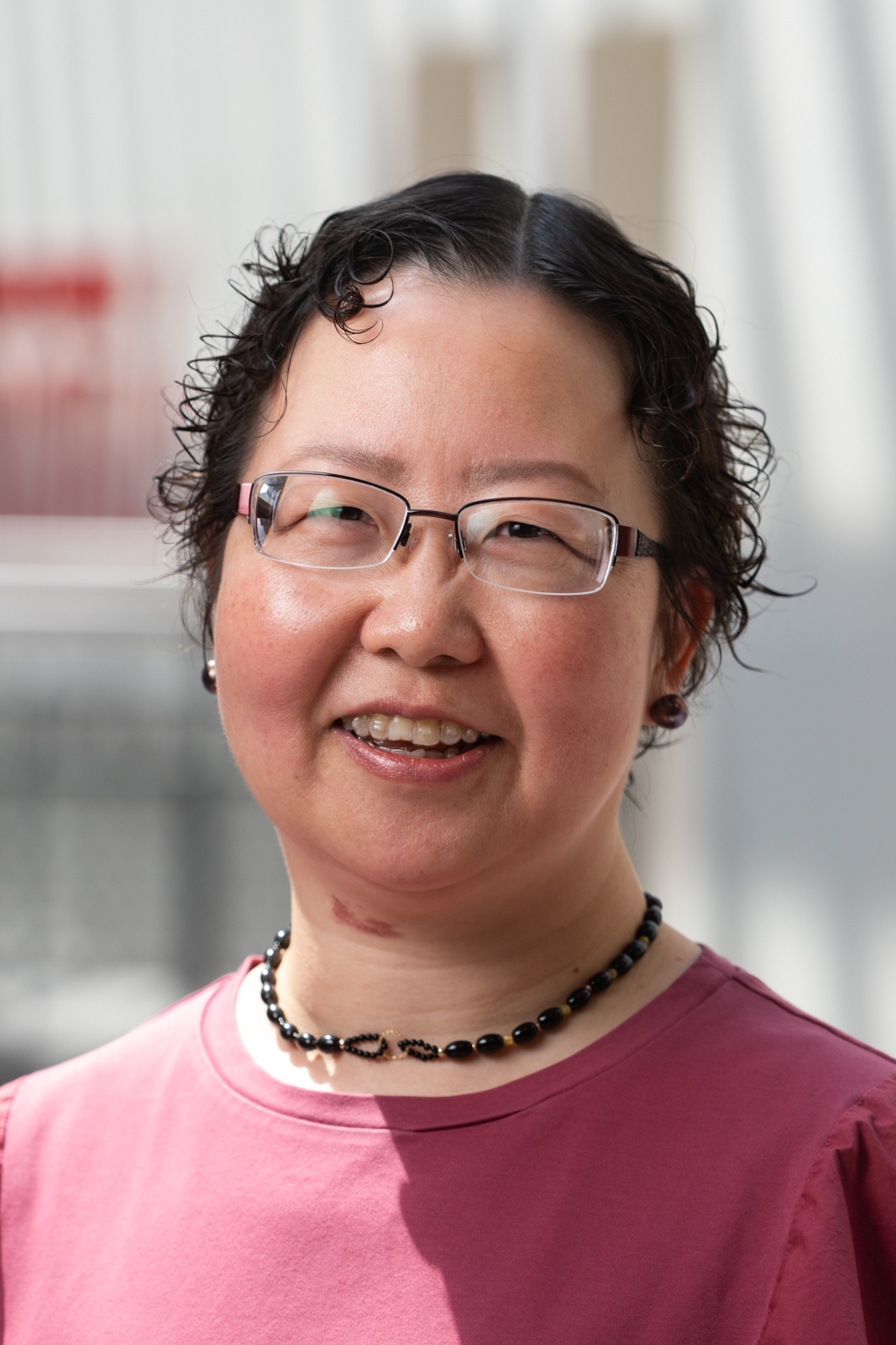 A portrait photo of Huaibo Xin, DrPH, MD, MPH