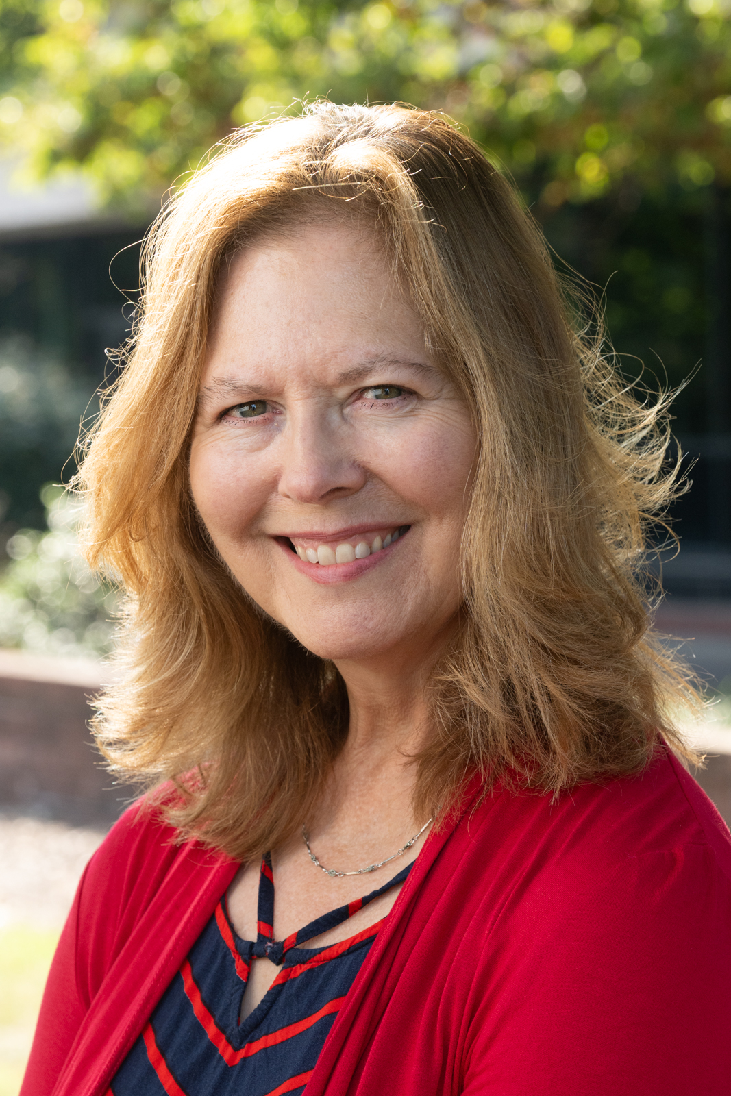 A portrait photo of Kay Weis