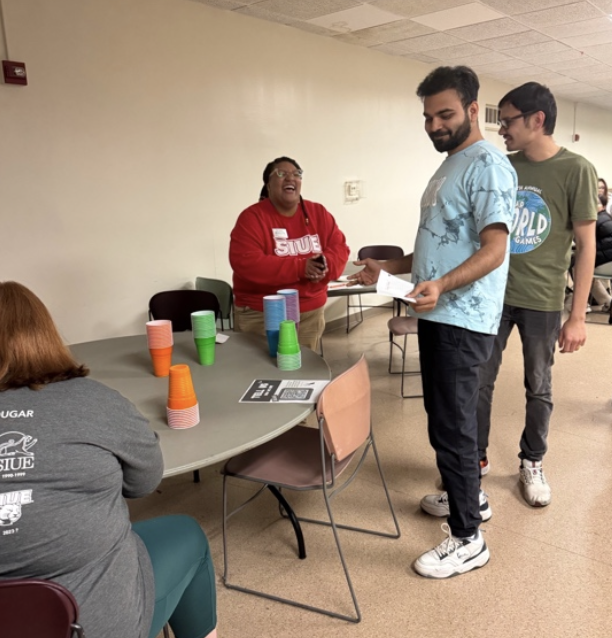 students play minute to win it games with EOA practicum students