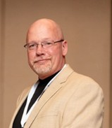 A portrait photo of Don Davis