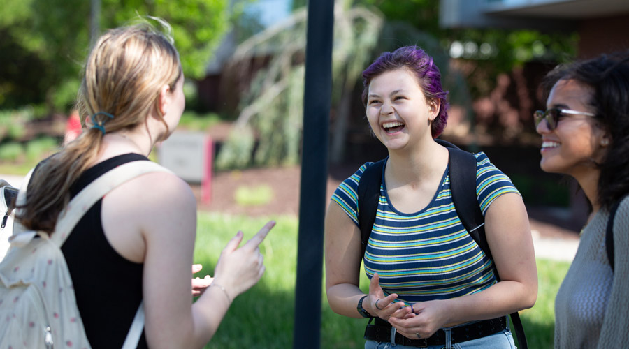 SIUE student laughing outside.